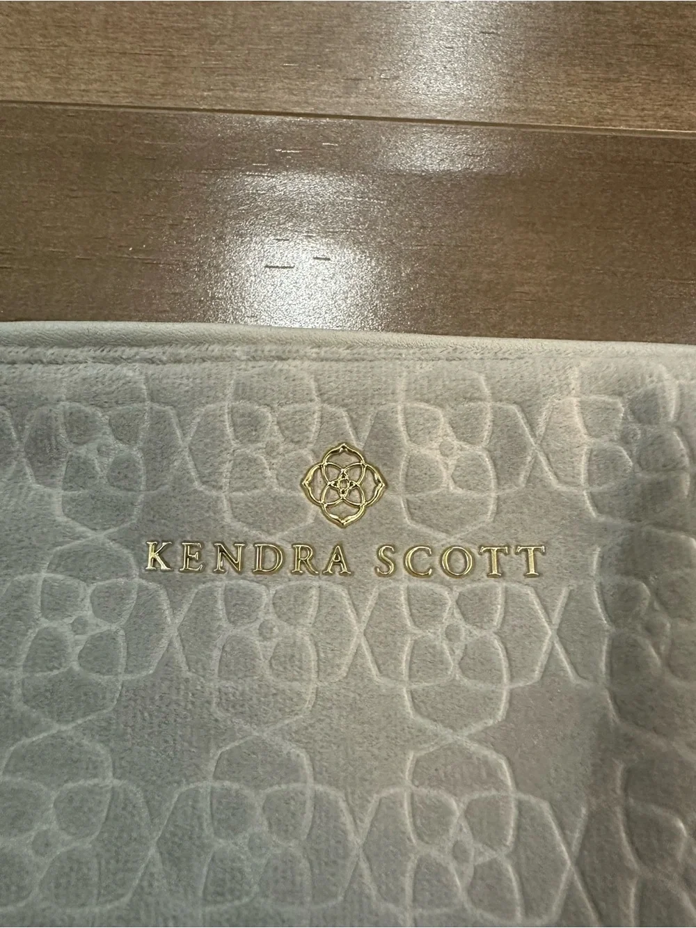 Kendra Scott Light Gray Logo Embossed Pouch with Gold Accent